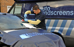 A technician repairs a windscreen