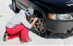 Snow chains being fitted