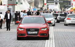 Low-emission cars ferry journalists among the halls at Frankfurt Motor Show