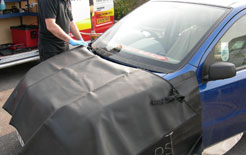 Preparing a car before windscreen replacement