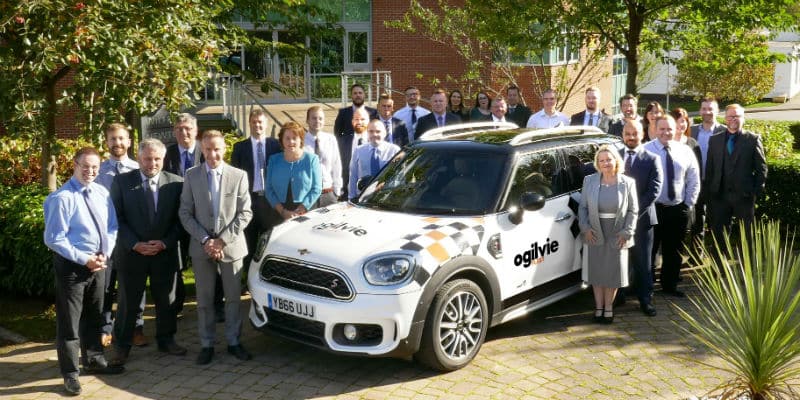 Ogilvie Fleets Sheffield office employees surround a specially liveried Mini celebrating 10 years of delivering service excellence in England