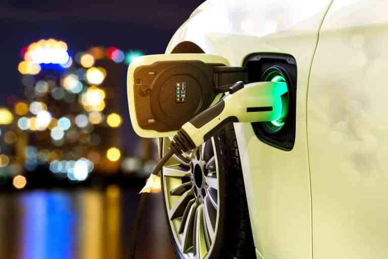 EV Car or Electric car at charging station