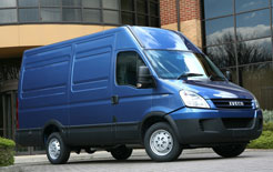Blue Iveco van parked outside a modern building, representing vehicle emissions calculation.