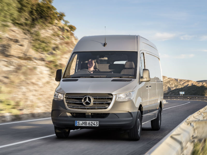 Silver Mercedes-Benz Sprinter van driving on UK motorway