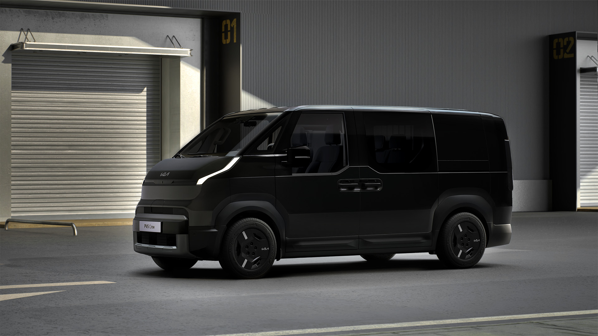 Black Kia EV9 electric van parked in industrial unit with roller shutter doors.