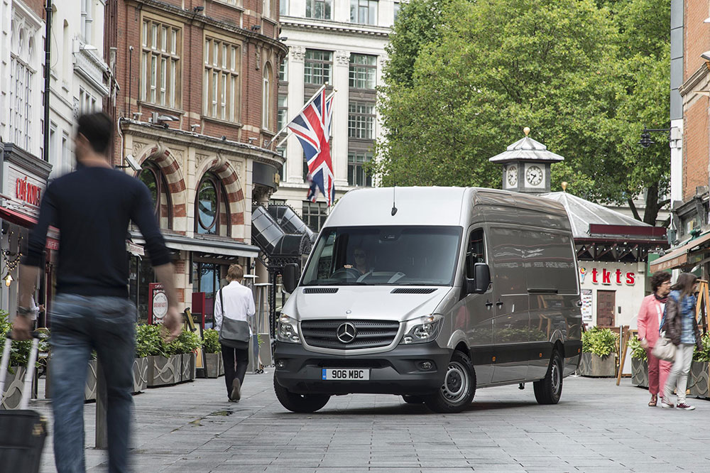 Mercedes-Benz van parked on a pedestrianised street in central London, with historic buildings and shoppers in the…