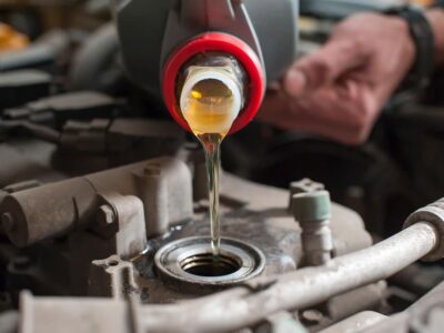 TotalEnergies launches waste oil collection and recycling service a-man-pours-oil-into-a-car-engine-close-up-2022-11-14-02-16-38-utc