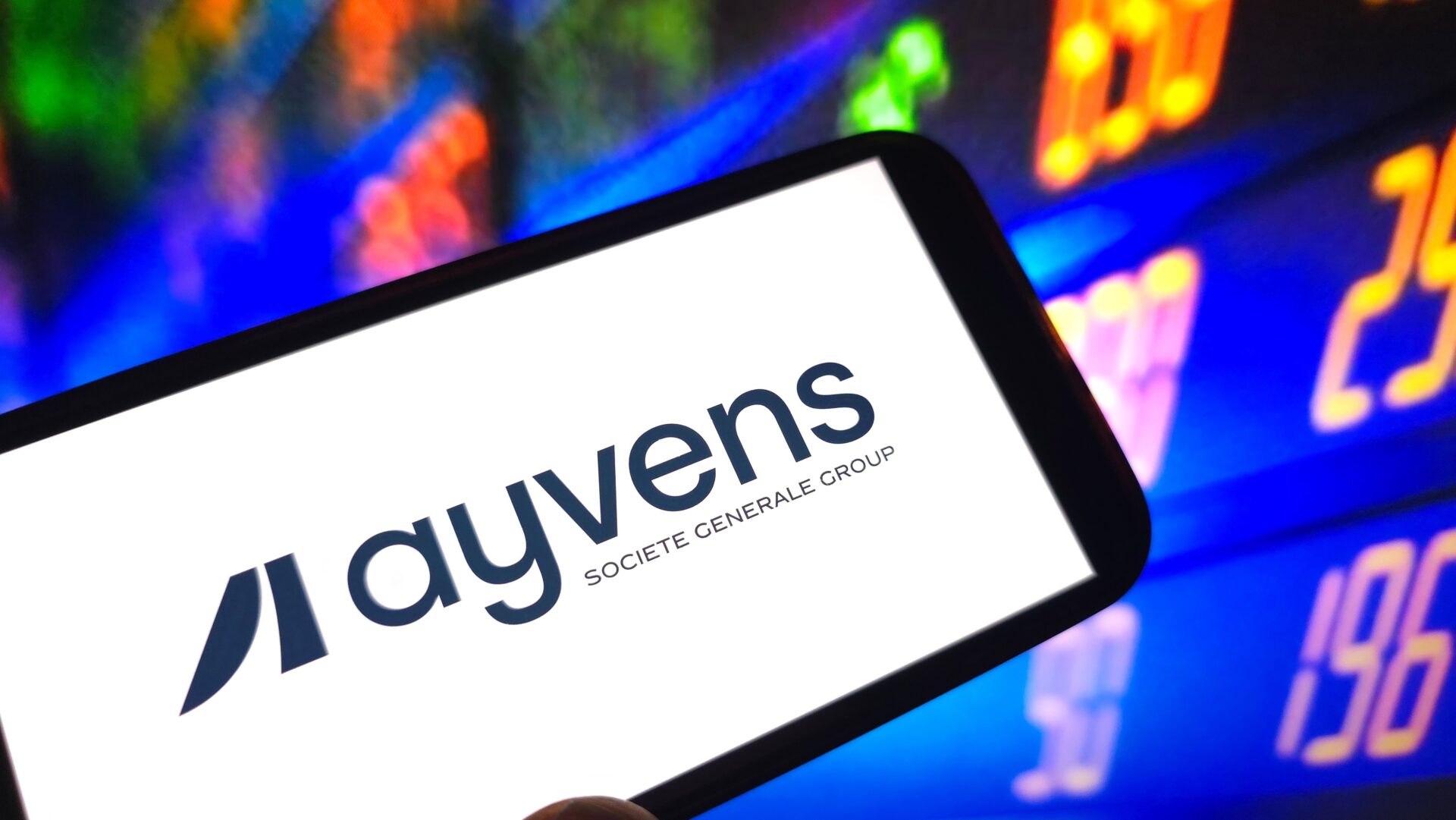 Ayvens logo displayed on smartphone screen with colourful blurred background