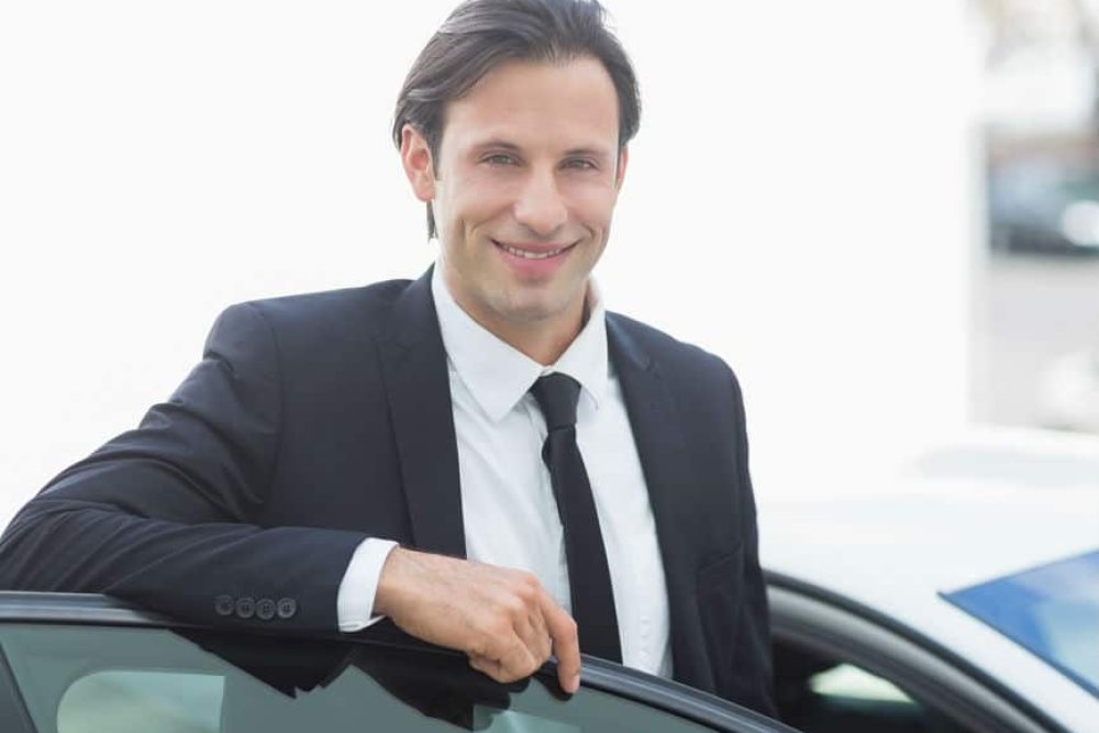 Businessman with a car bought on lease purchase