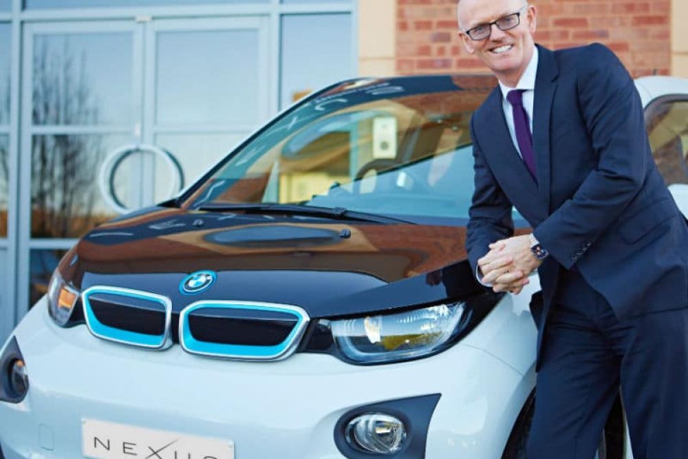 David Brennan CEO Nexus Vehicle Rental with car