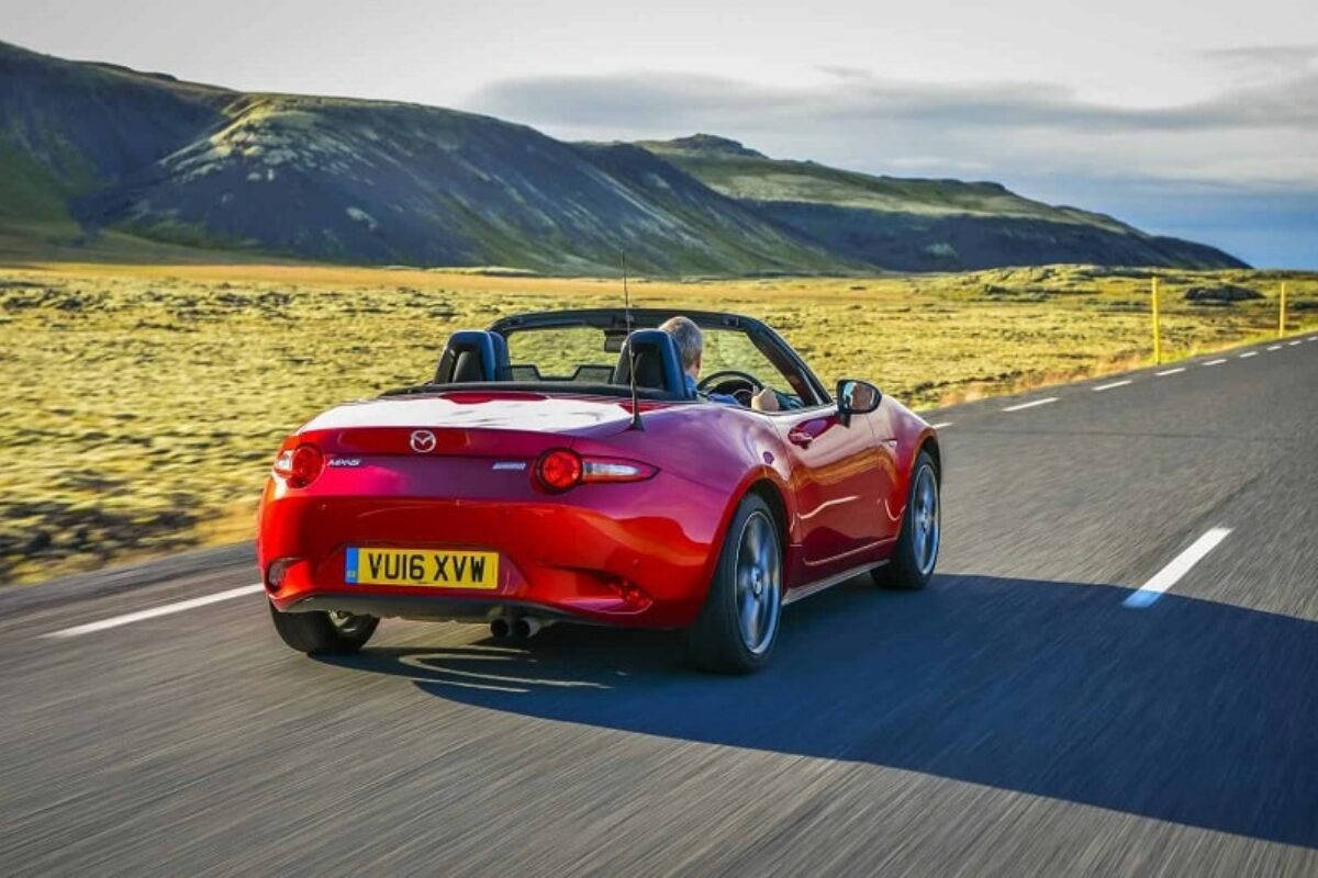 Mazda MX5 driving in sunshine