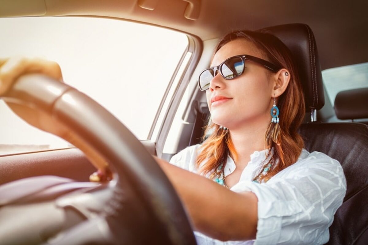 Woman at the wheel of a car on personal contract hire