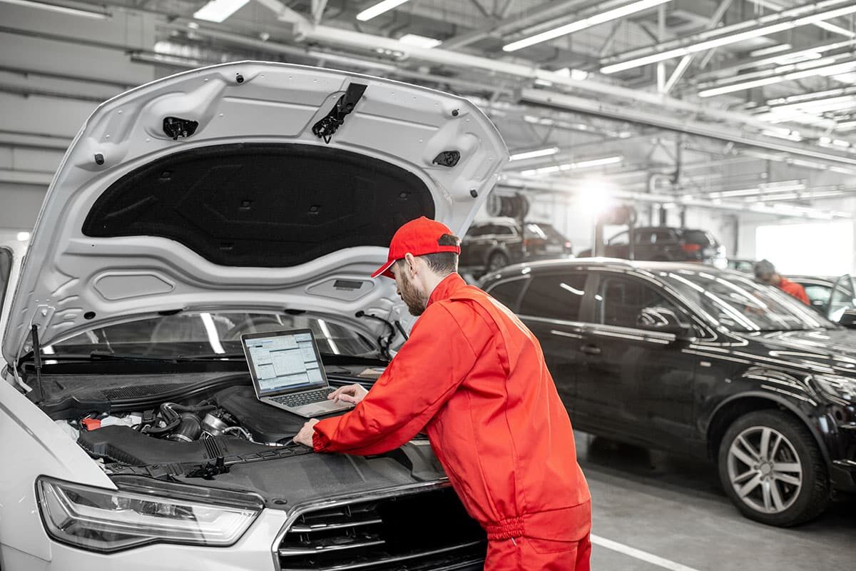 auto mechanics doing diagnostics with laptop 2022 01 19 00 27 22 utc 1