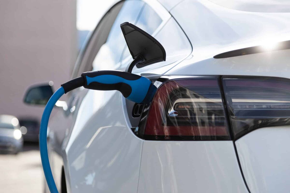ev electric car pluged charging at a recharge stat c9mcd4w
