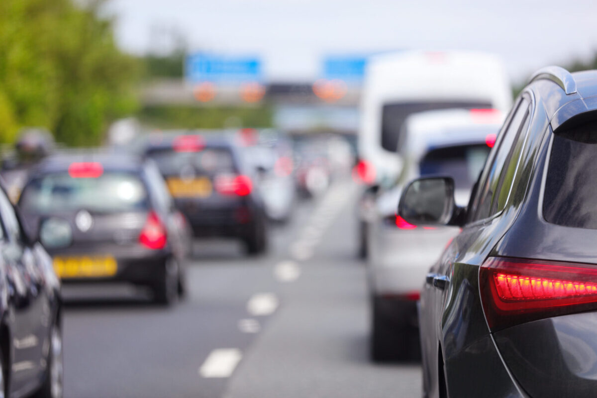 Traffic jam congestion with rows of cars on highway or motorway