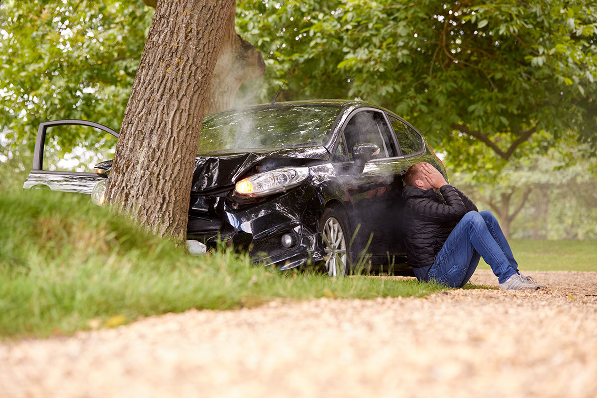 teenage driver with head in hands sitting next to 2023 11 27 04 57 12 utc
