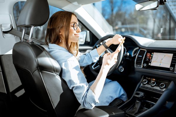woman-with-phone-in-the-car-2022-01-19-00-03-48-utc